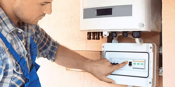 Employee Making Inverter Adjustments